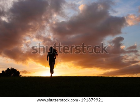 Silhouette od young woman running