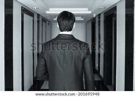 Businessman shot from the back. Business concept.