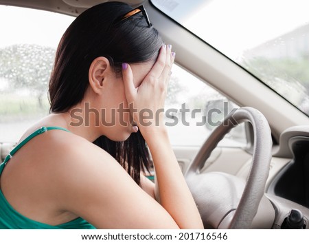 Transportation concept - stressed woman driver.