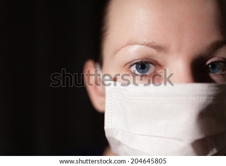 Portrait of young doctor with face mask.
