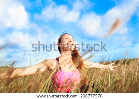Woman enjoying beautiful summer day. Religion, prayer concept.