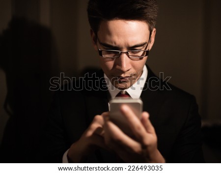 Business man using mobile smart phone