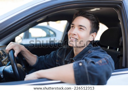 Man driver driving a car