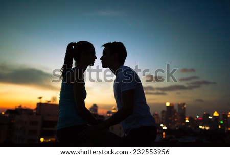 Romantic couple kissing in the city