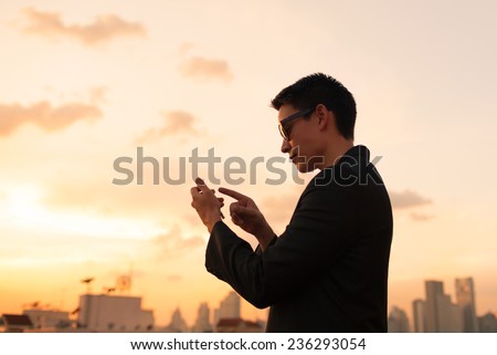 Business man using mobile smart phone