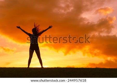 Young woman spreading hands with joy and inspiration