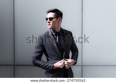 Handsome fashion model in a suit.
