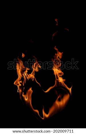 High resolution flame of fire in a burning heart isolated on black background