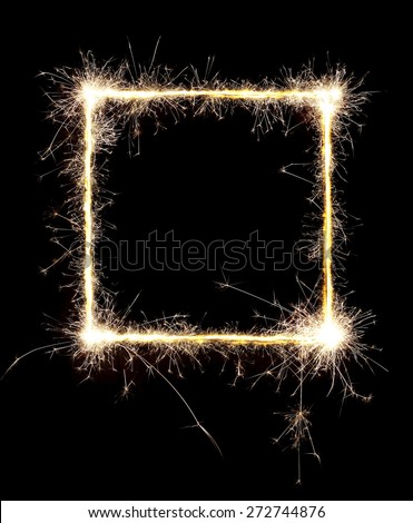 Burning sparklers isolated on black background. Small fireworks giving off sparks of fire. Sparks explosion. High resolution.