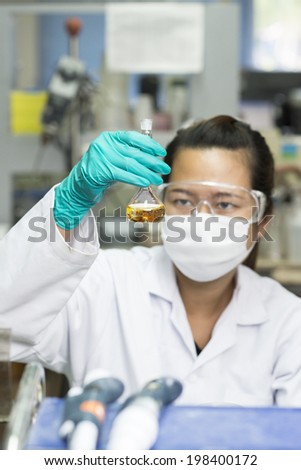 Lady holding test glass with blur face