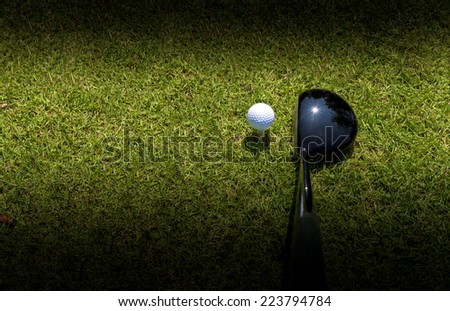 Golf driver driving ball with vignette as abstract