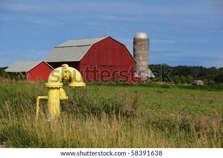 Yellow Iron Gate Valves on the farm land