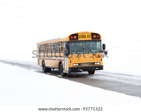 School bus driving in the winter on rural road