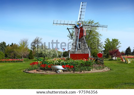Windmill in beautiful garden at Holland