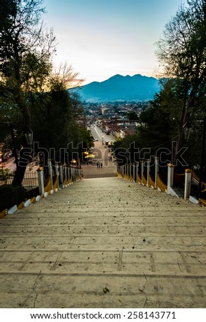 Street view and sidewalk on San Cristobal de las Casas colonial town. Latin American Culture.