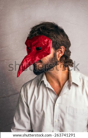 Work joker, using a mask on a job suit.