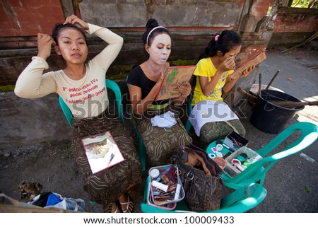 BALI, INDONESIA - APRIL 9: Balinese girls preparing for a classic national Balinese dance Barong on April 9, 2012 on Bali, Indonesia. Barong is very popular cultural show on Bali.