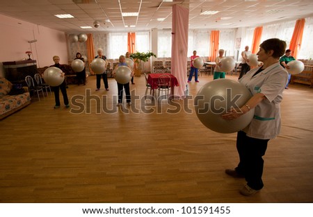 PODPOROZHYE, RUSSIA - MAY 3: Day of Health in Center of social services for pensioners and the disabled Otrada (gymnastics with ball for eldery), May 3, 2012 in Podporozhye, Russia.