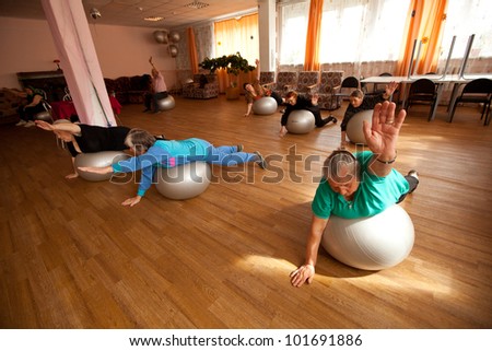PODPOROZHYE, RUSSIA - MAY 4: Day of Health in Center of social services for pensioners and disabled Otrada (gymnastics with ball for eldery), May 4, 2012 in Podporozhye, Russia.