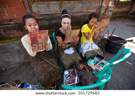 BALI, INDONESIA - APRIL 9: Balinese girls preparing for a classic national Balinese dance Barong on April 9, 2012 on Bali, Indonesia. Barong is very popular cultural show on Bali.