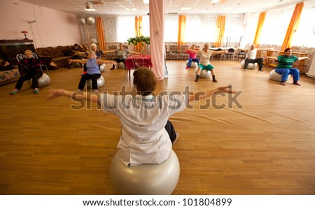 PODPOROZHYE, RUSSIA - MAY 3: Day of Health in Center of social services for pensioners and the disabled Otrada (gymnastics with ball for eldery), May 3, 2012 in Podporozhye, Russia.