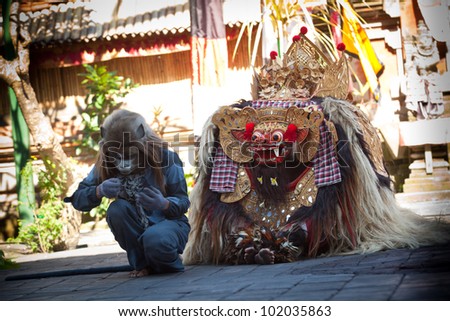 BALI, INDONESIA - APRIL 9: Monkey and Barong during a classic national Balinese dance Barong on April 9, 2012 on Bali, Indonesia. Barong is very popular cultural show on Bali.