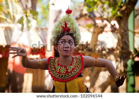 BALI, INDONESIA - APRIL 9: Young girl performs a classic national Balinese dance Barong on April 9, 2012 on Bali, Indonesia. Barong is very popular cultural show on Bali.
