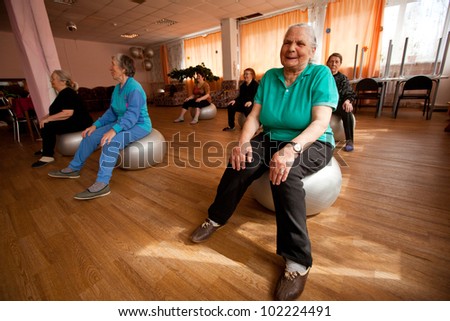 PODPOROZHYE, RUSSIA - MAY 4: Day of Health in Center of social services for pensioners and disabled Otrada (gymnastics with ball for eldery), May 4, 2012 in Podporozhye, Russia.
