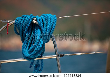 Close-up of a mooring rope on a modern yacht, background image with space for text or logos.