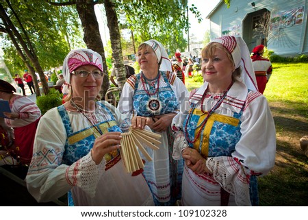 VINNICI, LENINGRAD REGION, RUSSIA - JUNE 10: Local people during celebrate the annual holiday Vepsian national culture Tree of Life (vepssk.Elo-pu), June 10, 2012 in the village Vinnici, Russia.