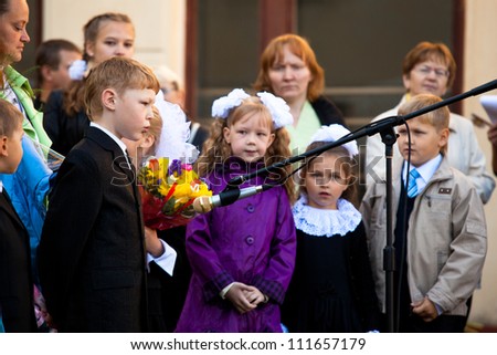 PODPOROZHYE, RUSSIA - SEPTEMBER 1: Unidentified children during celebration Knowledge Day on Sept 1, 2012 in Podporozhye, Russia. Knowledge Day originated in the USSR on 1984, and celebrated annually.