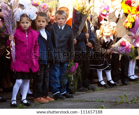 PODPOROZHYE, RUSSIA - SEPTEMBER 1: Unidentified children during celebration Knowledge Day on Sept 1, 2012 in Podporozhye, Russia. Knowledge Day originated in the USSR on 1984, and celebrated annually.