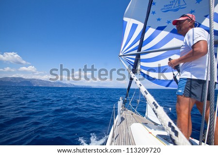 MEDITERRANEAN SEA, TURKEY- MAY 29: Unidentified sailor participates in sailing regatta Sail & Fun Trophy 2012 from Marmaris to Fethiye, May 29, 2012 in the Mediterranean Sea, Turkey.