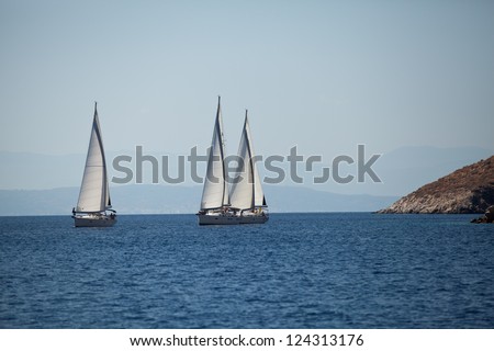 SARONIC GULF, GREECE - SEPT 24: Competitors boats during of sailing regatta 