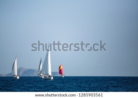 Luxury sailing boats participate in yacht regatta, Aegean Sea - Greece.