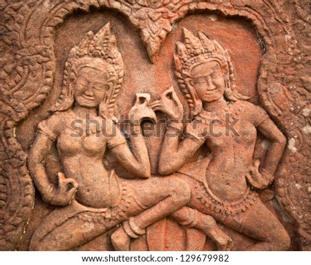 SIEM REAP, CAMBODIA - DEC 13: Apsaras - khmer stone carving in Angkor Wat, Dec 13, 2012 on Siem Reap, Cambodia. Angkor is the country\'s prime attraction for visitors.