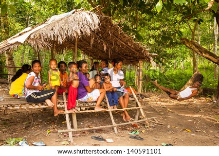 BERDUT, MALAYSIA - APR 8: Unidentified children Orang Asli in his village on Apr 8, 2013 in Berdut, Malaysia. More than 76% of all Orang Asli live below the poverty line, life expectancy 53 years old.