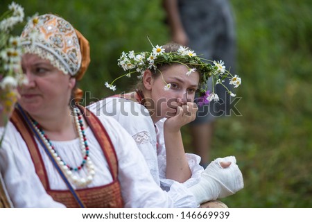 TERVENICHI, RUSSIA - JUL 7: Unidentified girl during Ivan Kupala Day, Jul 7, 2013, Tervenichi, Russia. The celebration relates to the summer solstice and includes a number of fascinating Pagan rituals