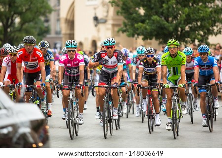 KRAKOW, POLAND - JULY 30: Unidentified participants of 70th Tour de Pologne cycling 3rd stage race, July 30, 2013 in Krakow, Poland. Tour de Pologne, the biggest cycling event in Eastern Europe.