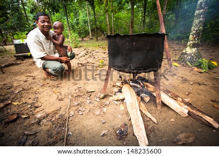 BERDUT, MALAYSIA - APR 8: Unidentified child Orang Asli in his village on Apr 8, 2013 in Berdut, Malaysia. More than 76% of all Orang Asli live below the poverty line, life expectancy - 53 years old.