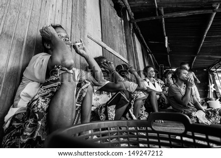 BERDUT, MALAYSIA - APR 8: Unidentified woman Orang Asli in his village (b/w photo) on Apr 8, 2013 in Berdut, Malaysia. More than 76% of all Orang Asli live below the poverty line.