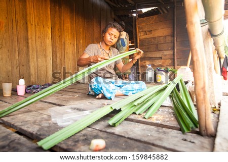 BERDUT, MALAYSIA - APR 8: Unidentified woman Orang Asli in his village on Apr 8, 2013 in Berdut, Malaysia. More than 76% of all Orang Asli live below the poverty line, life expectancy - 53 years old.