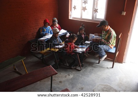 KATHMANDU, NEPAL - JANUARY 3: lesson in small primary school in poor area of city on January 3, 2008 in Kathmandu, Nepal. The government gives a great attention to school education in Nepal and spent 2.3%of GDP on education expenditure.