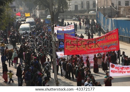 KATHMANDU, NEPAL - DECEMBER 30: Nepalese caste Gurung celebrate their traditional New Year. A procession in traditional costumes goes around the city, men beat the drums, and women dance, December 30, 2008.