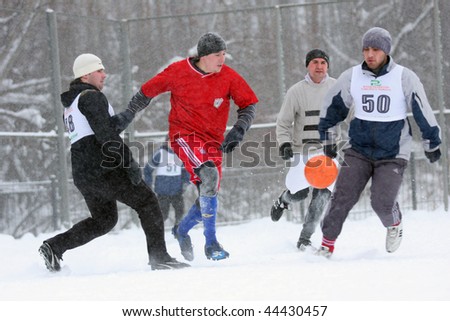 TOMSK, RUSSIA - DECEMBER 12: Playing football in the snow - traditional Siberian winter sport, December 12, 2009 in Tomsk, Russia.