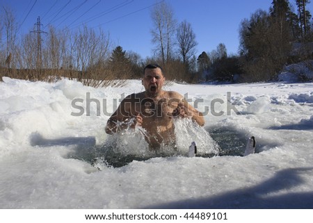 TOMSK, RUSSIA - MARCH 7: Traditional Siberian winter recreation - swimming in the ice-hole, March 7, 2009 in Tomsk, Russia.