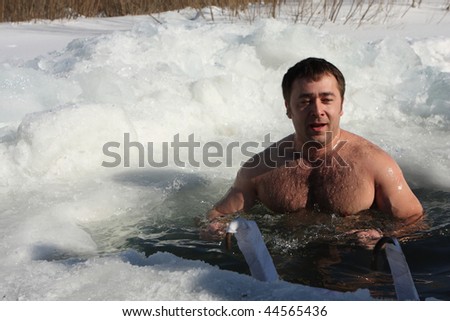 TOMSK, RUSSIA - MARCH 7: Traditional Siberian winter recreation - swimming in the ice-hole, March 7, 2009 in Tomsk, Russia.
