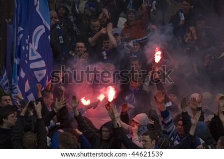 TOMSK, RUSSIA - APRIL 5: Fans of Football Club Zenit at the match Championship of Russia among Tom'(Tomsk) - Zenit (Spb), April 5, 2009 in Tomsk, Russia.