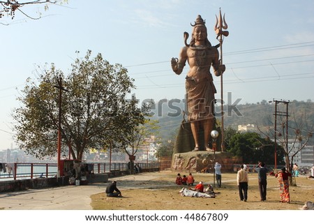 HARIDWAR, INDIA - JANUARY 14: People worship the Shiva Statue at the festival of Kumbha Mela, huge Religious festival regarding Sun and Harvest, January 14, 2009 in Haridwar, India.