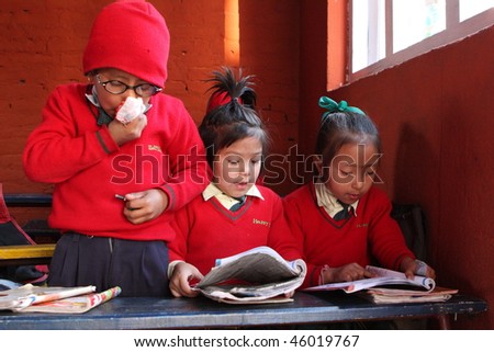 KATHMANDU, NEPAL - JANUARY 1: Pupil in learning session during lesson in small primary school \